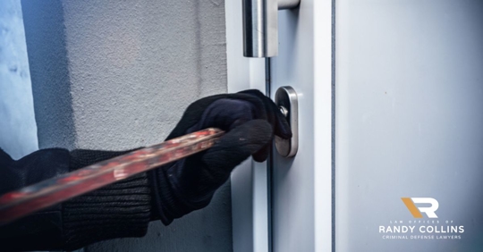 robbery underway, breaking into door