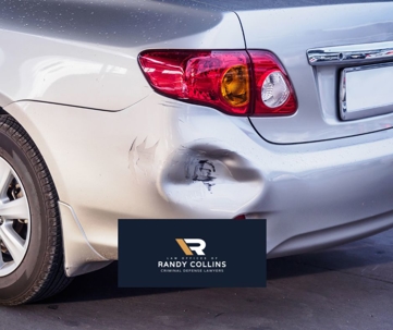 dent in bumper of car