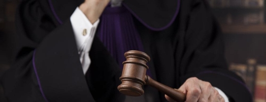 judge in robe holding gavel